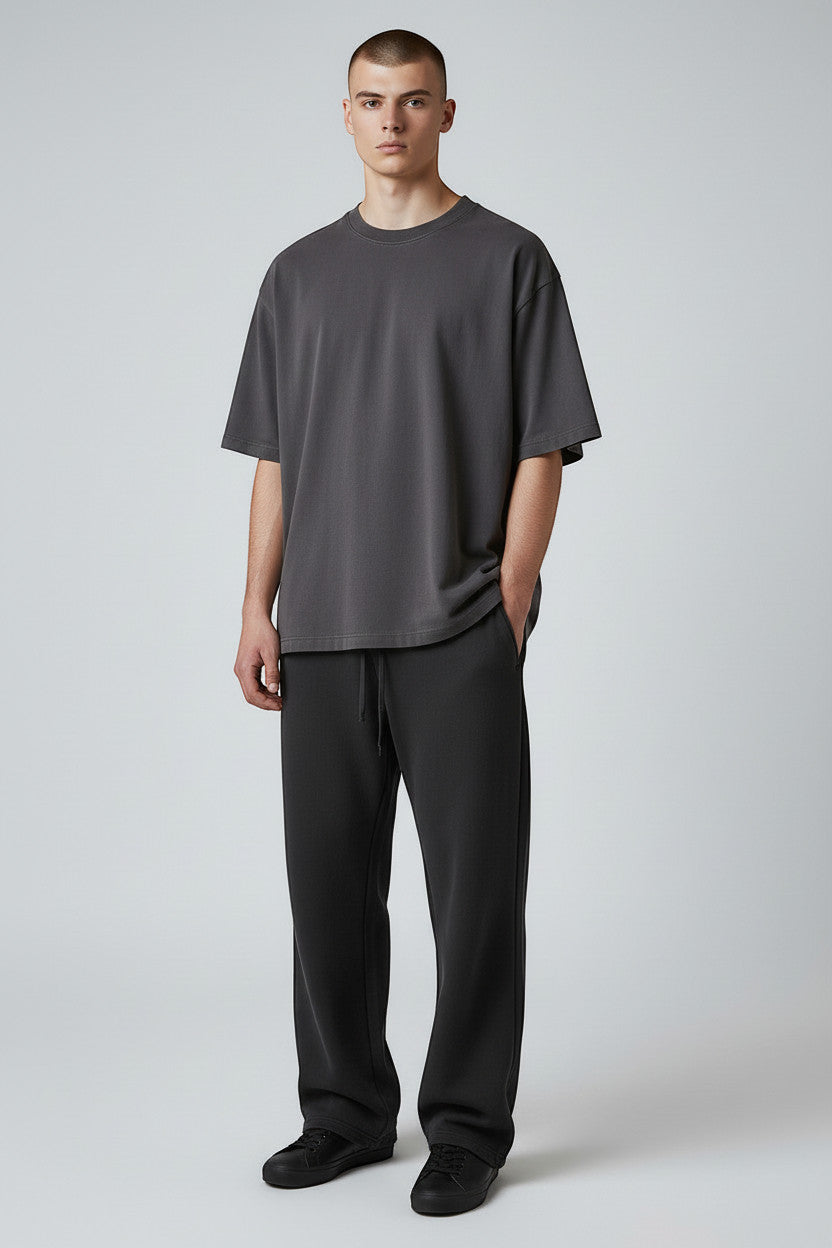 Lumnco dark grey stretch-woven sweatpants with rope drawcord and tapered silhouette.
