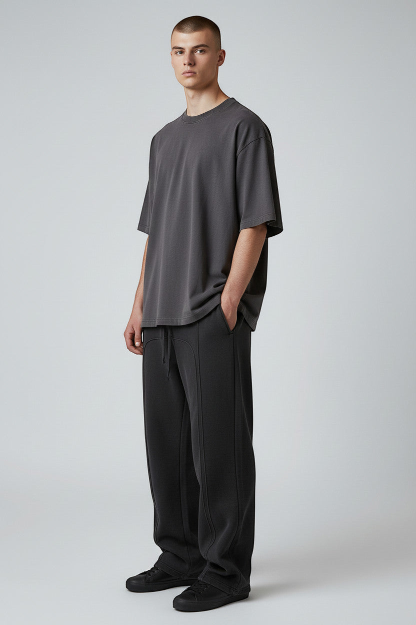 Lumnco dark grey stretch-woven sweatpants with rope drawcord and tapered silhouette.