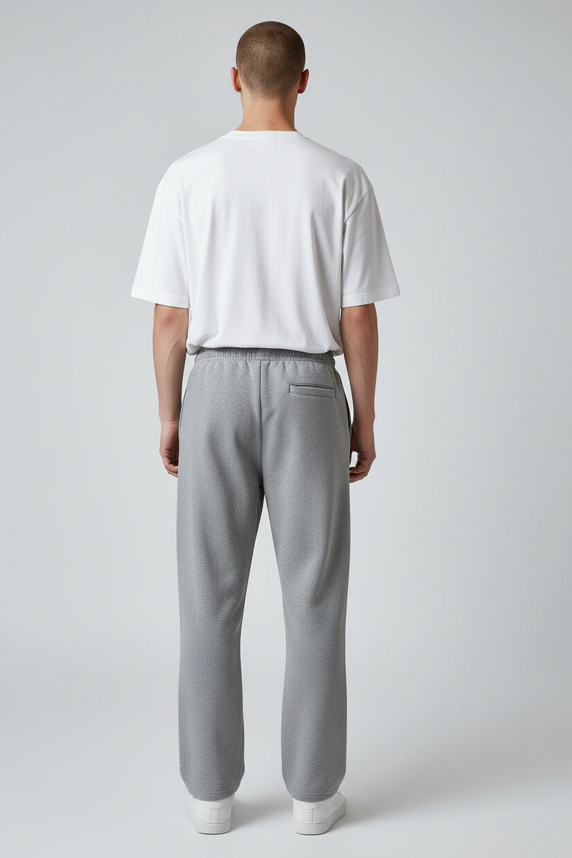 Lumnco grey heathered cotton blend sweatpants with rope drawcord and tapered silhouette.